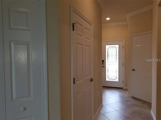a view of a hallway with windows