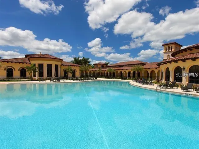 a view of swimming pool is middle in the garden