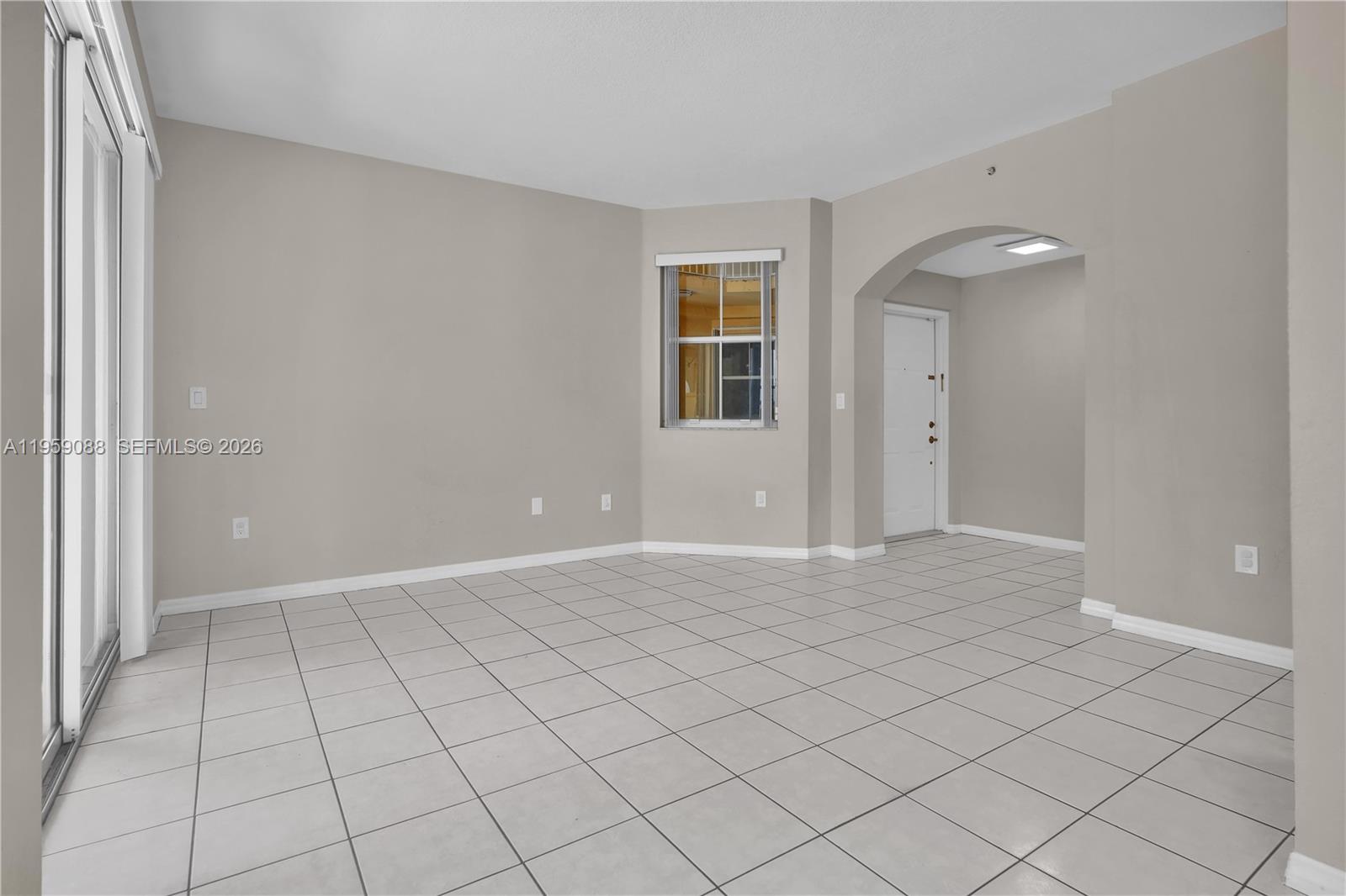 8964 West Flagler Street, Unit 109 Miami, FL 33174 - Photo 11 of 39 a view of an empty room and window