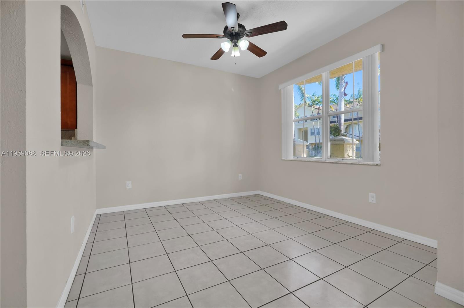 8964 West Flagler Street, Unit 109 Miami, FL 33174 - Photo 16 of 39 a view of an empty room with a window