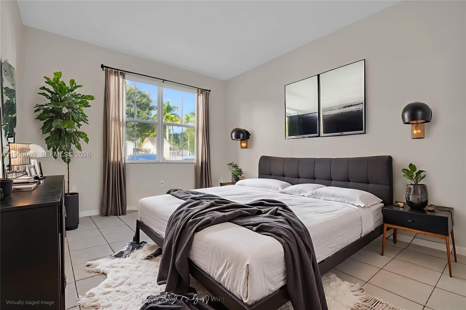 8964 West Flagler Street, Unit 109 Miami, FL 33174 - Photo 19 of 39 a bedroom with a bed and window