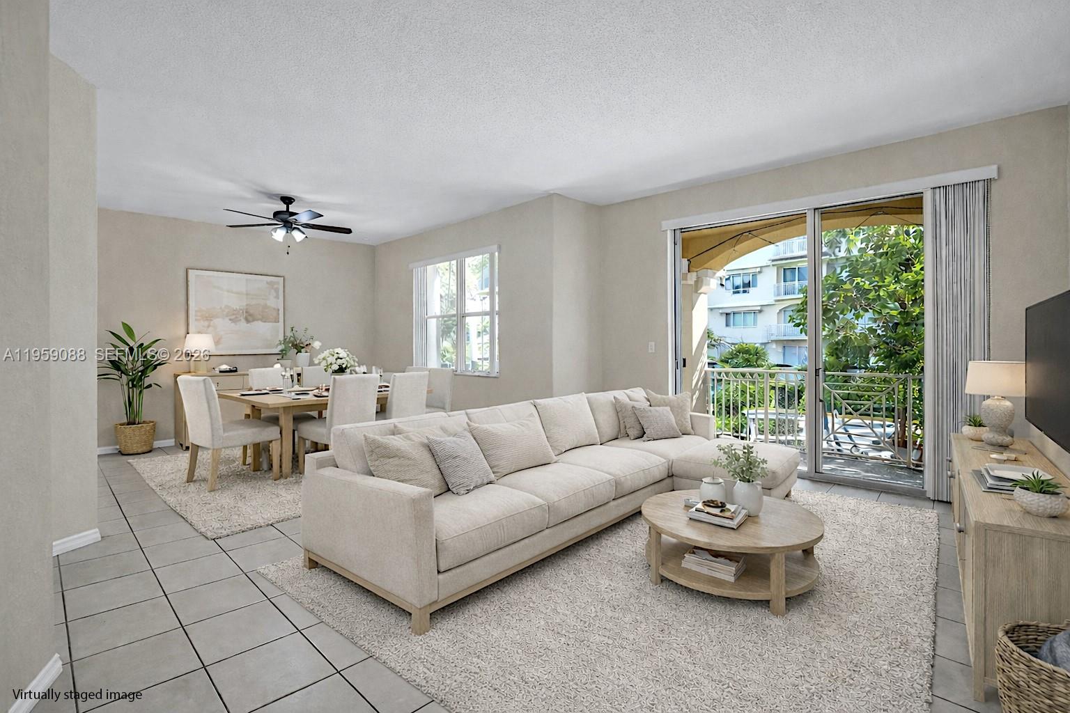 8964 West Flagler Street, Unit 109 Miami, FL 33174 - Photo 3 of 39 a living room with furniture and a large window