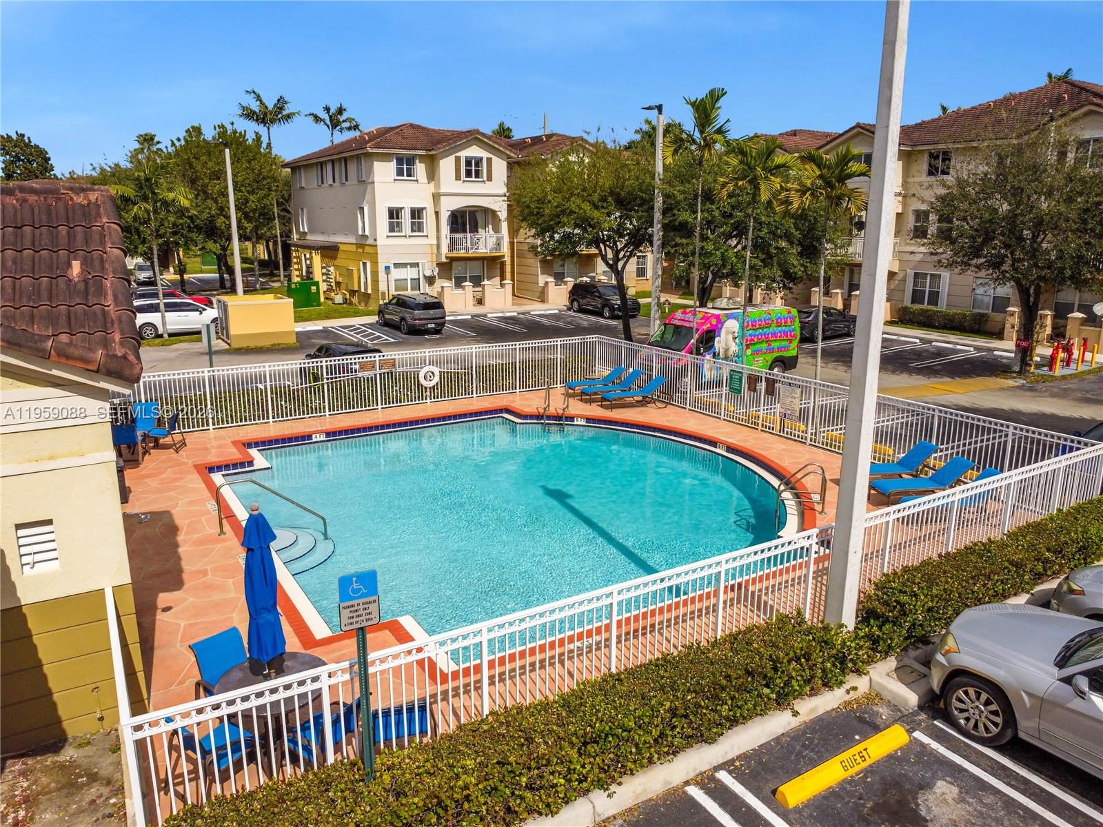 8964 West Flagler Street, Unit 109 Miami, FL 33174 - Photo 35 of 39 a view of swimming pool with outdoor seating