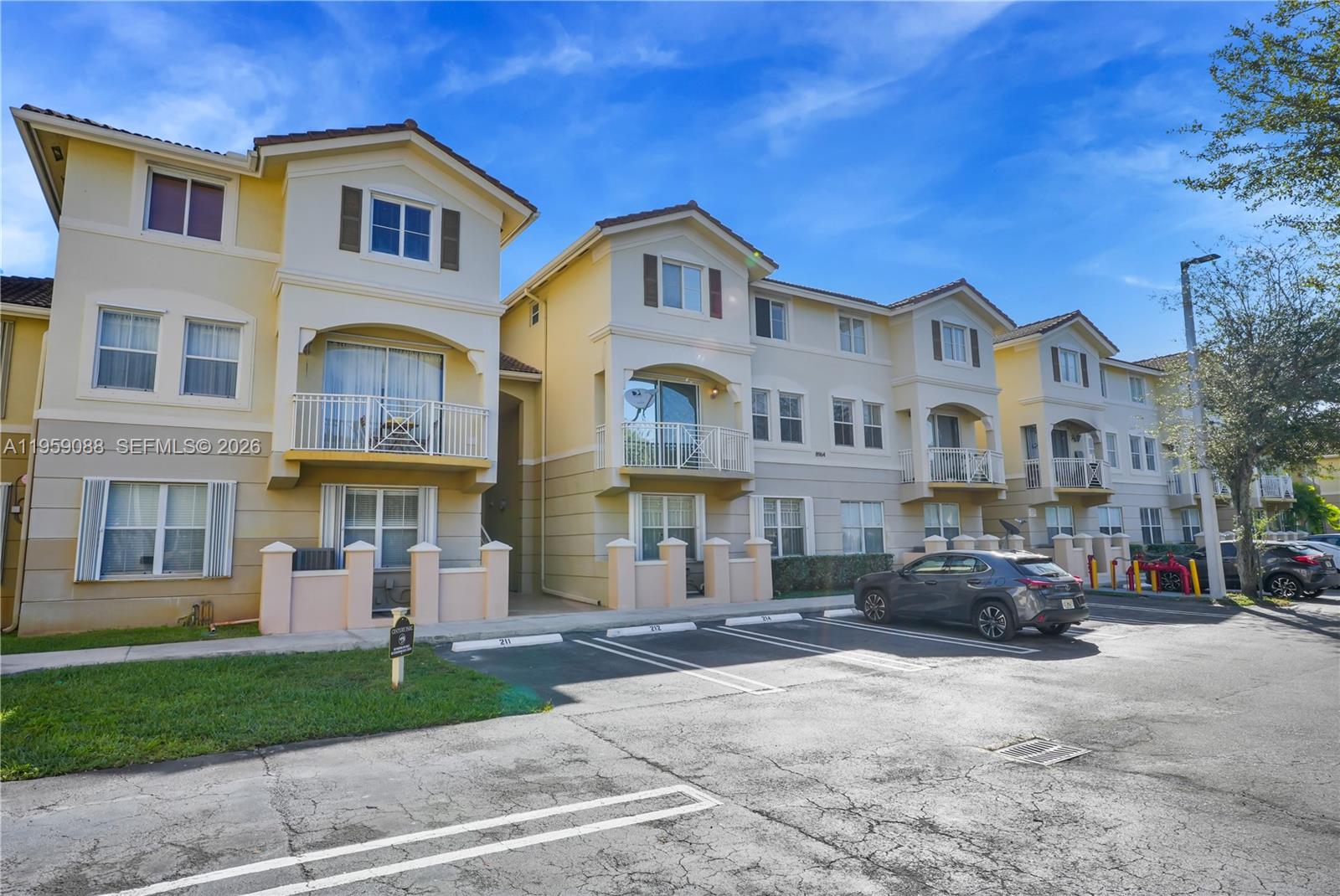 8964 West Flagler Street, Unit 109 Miami, FL 33174 - Photo 38 of 39 a front view of a house with a yard