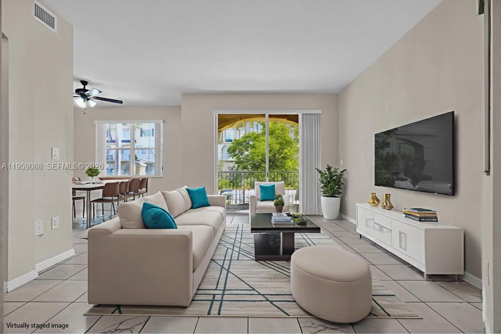 8964 West Flagler Street, Unit 109 Miami, FL 33174 - Photo 4 of 39 a living room with furniture and a flat screen tv