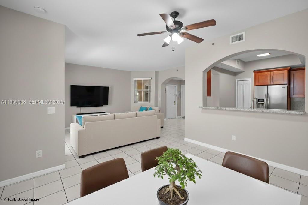 8964 West Flagler Street, Unit 109 Miami, FL 33174 - Photo 5 of 39 a living room with furniture and a flat screen tv