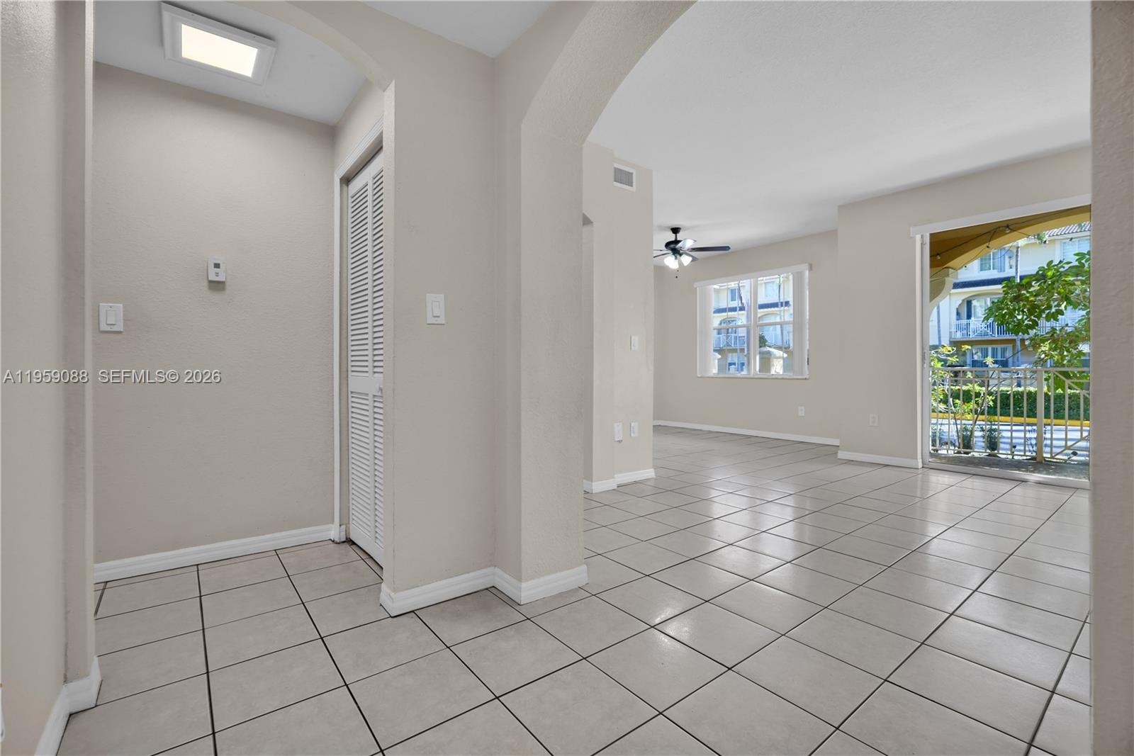 8964 West Flagler Street, Unit 109 Miami, FL 33174 - Photo 6 of 39 a view of an empty room and window
