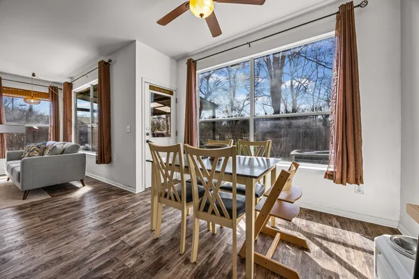 a view of a dining room with furniture window and wooden floor