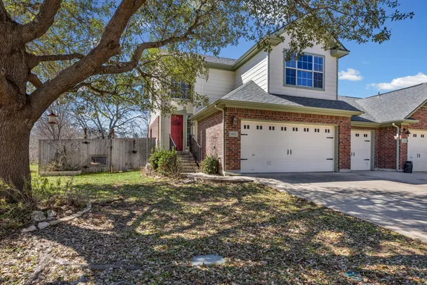 a house with a tree in front of it