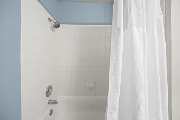 a bathroom with a shower curtain
