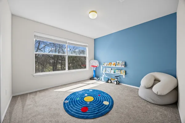 a room with furniture and a large window