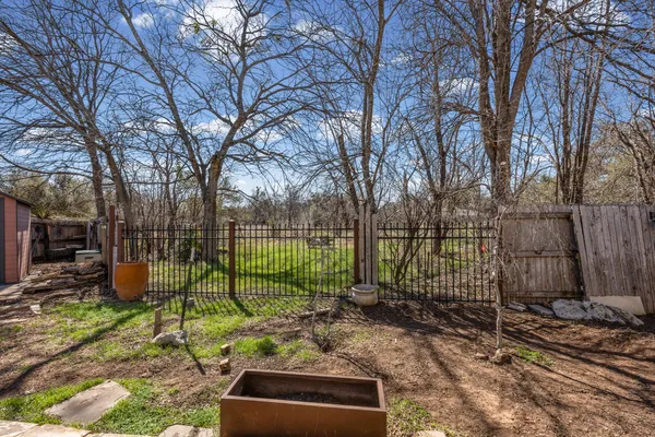 a view of a yard with a trampoline