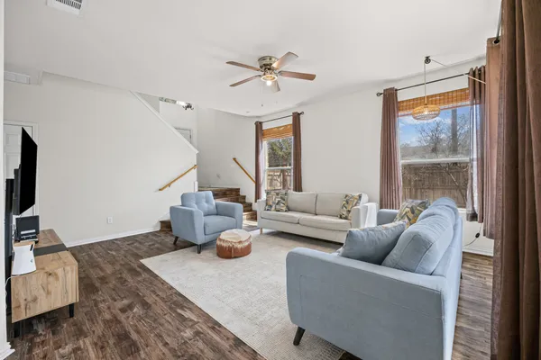 a living room with furniture and a large window