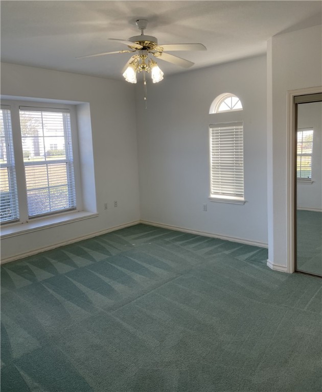 8101 Mt Zion Corpus Christi, TX 78413 - Photo 17 of 36 an empty room with windows and fan