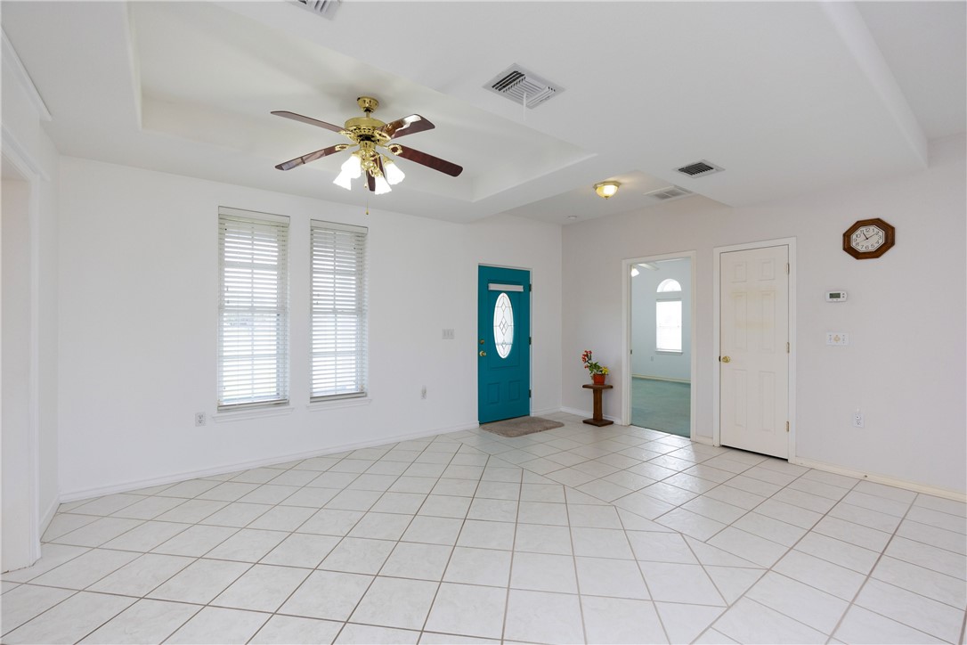 8101 Mt Zion Corpus Christi, TX 78413 - Photo 3 of 36 a view of an empty room with window and chandelier fan