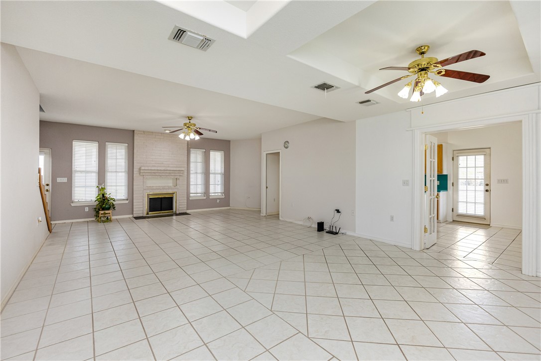 8101 Mt Zion Corpus Christi, TX 78413 - Photo 6 of 36 a view of an empty room and window with a chandelier fan