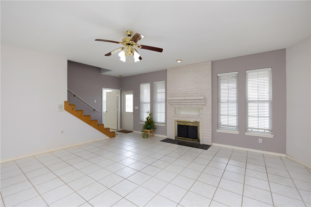 8101 Mt Zion Corpus Christi, TX 78413 - Photo 7 of 36 an empty room with windows and fireplace