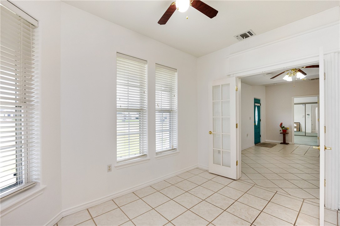 8101 Mt Zion Corpus Christi, TX 78413 - Photo 10 of 36 a view of a livingroom with a ceiling fan and window