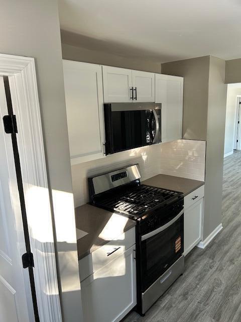 8322 Harrison Avenue Munster, IN 46321 - Photo 2 of 6 a kitchen with stainless steel appliances granite countertop a stove and a microwave