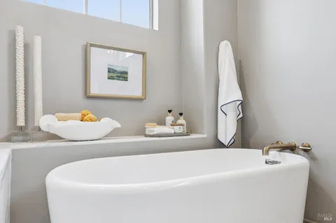 a view of a bedroom with washer and dryer