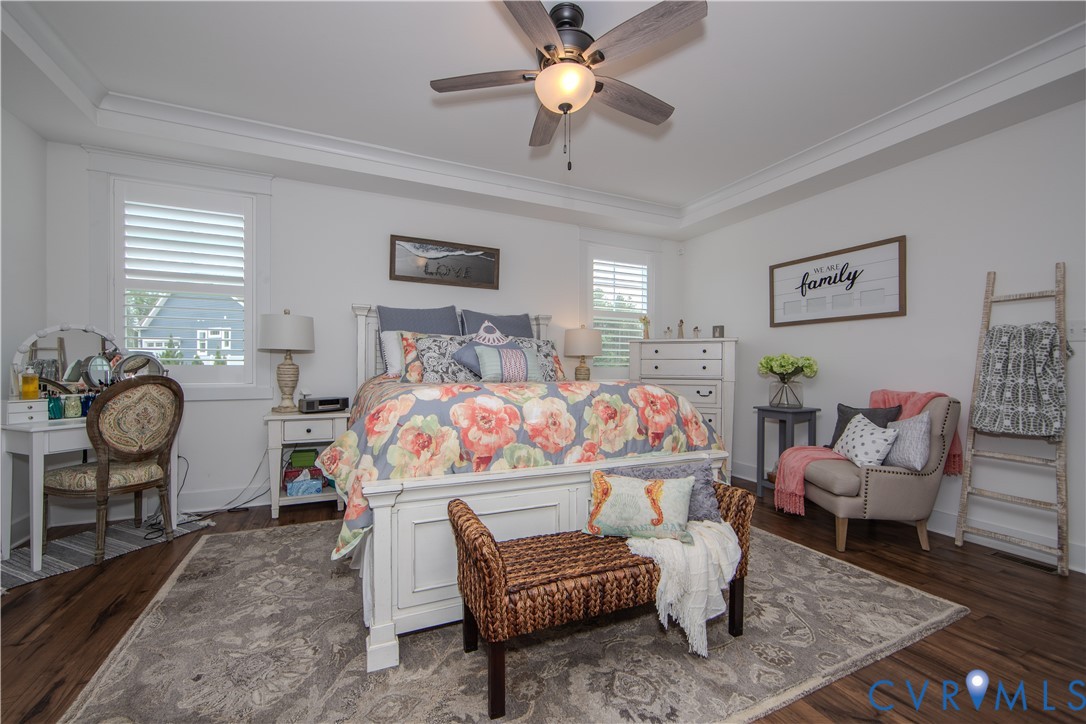 8406 Capernwray Drive Chesterfield, VA 23838 - Photo 17 of 47 a bedroom with a bed and a chandelier