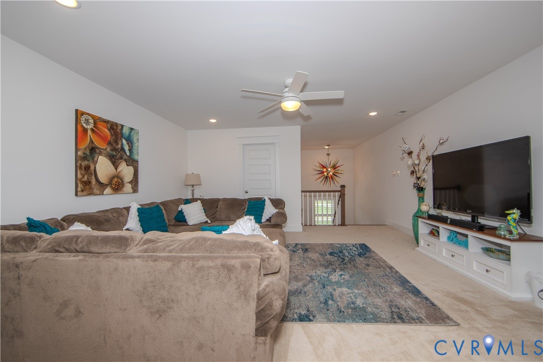 8406 Capernwray Drive Chesterfield, VA 23838 - Photo 38 of 47 a living room with furniture and a flat screen tv