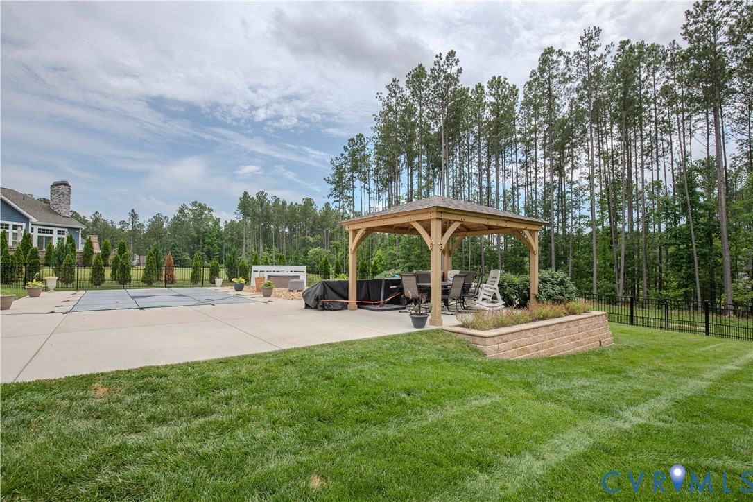 8406 Capernwray Drive Chesterfield, VA 23838 - Photo 44 of 47 a view of a house with backyard and sitting area