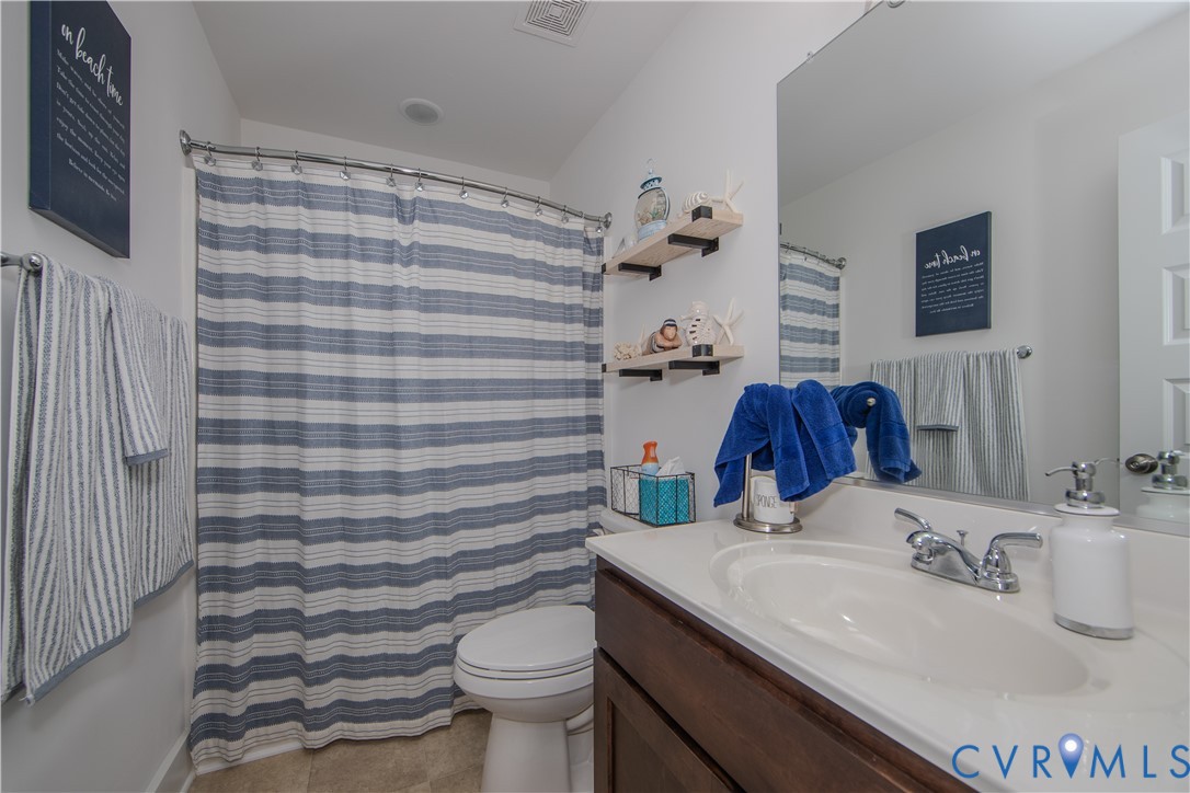 8406 Capernwray Drive Chesterfield, VA 23838 - Photo 5 of 47 a bathroom with a sink toilet and shower