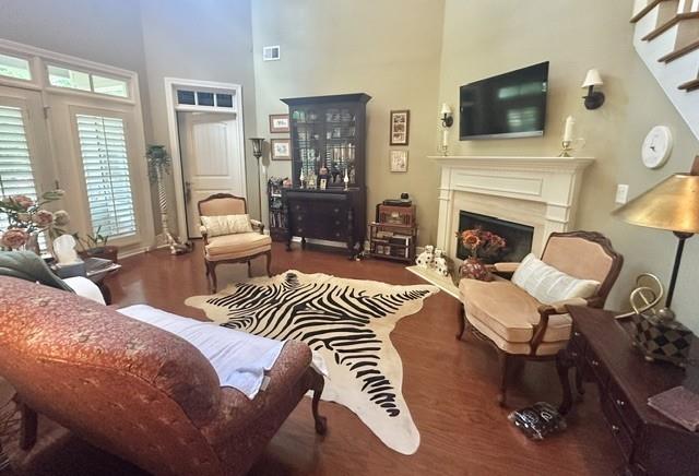 104 Willow Overlook Canton, GA 30115 - Photo 10 of 27 a bedroom with furniture a fireplace and a flat screen tv