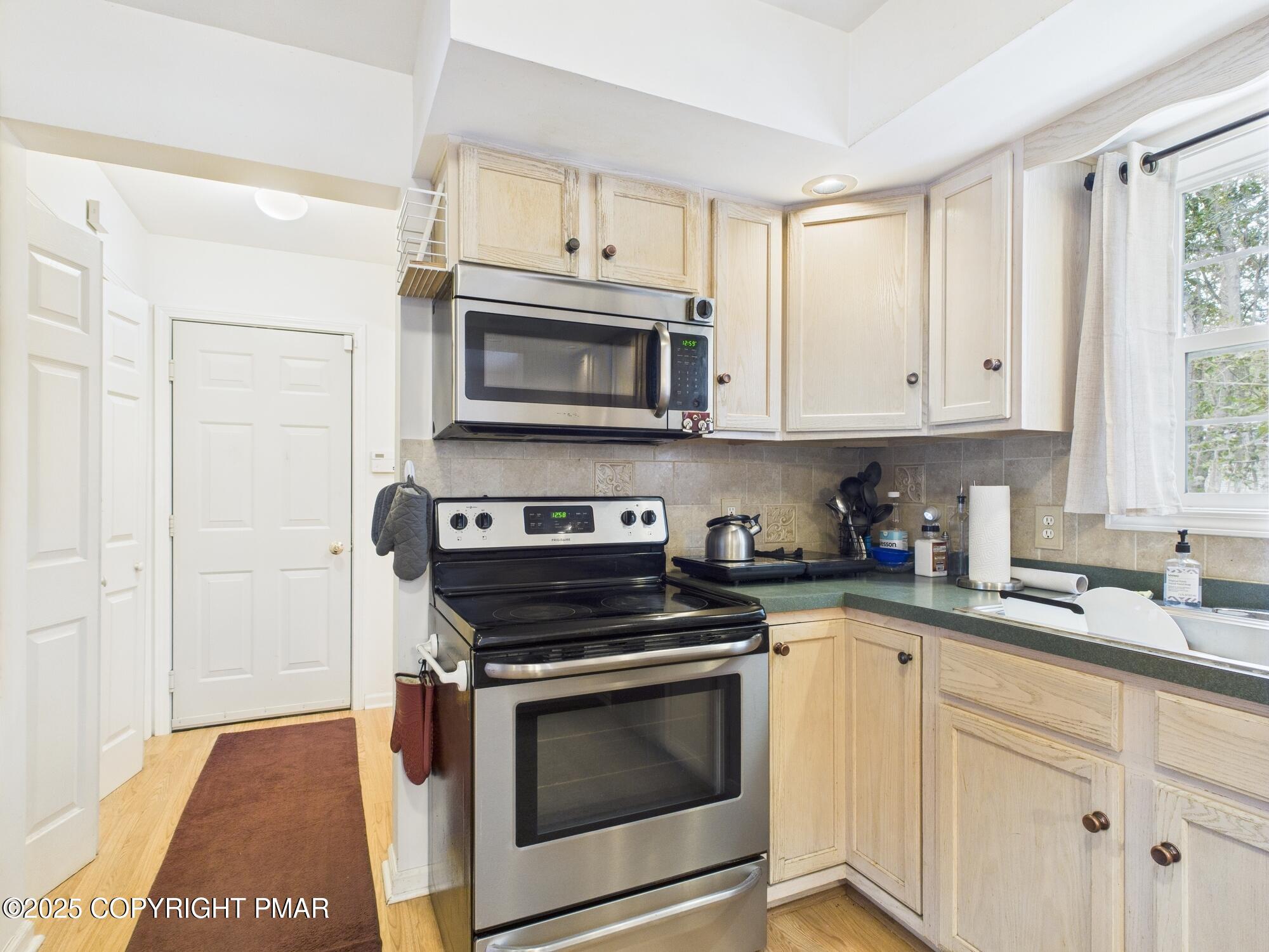 4155 Falcon Terrace Tobyhanna, PA 18466 - Photo 19 of 42 a kitchen with cabinets stainless steel appliances and a window