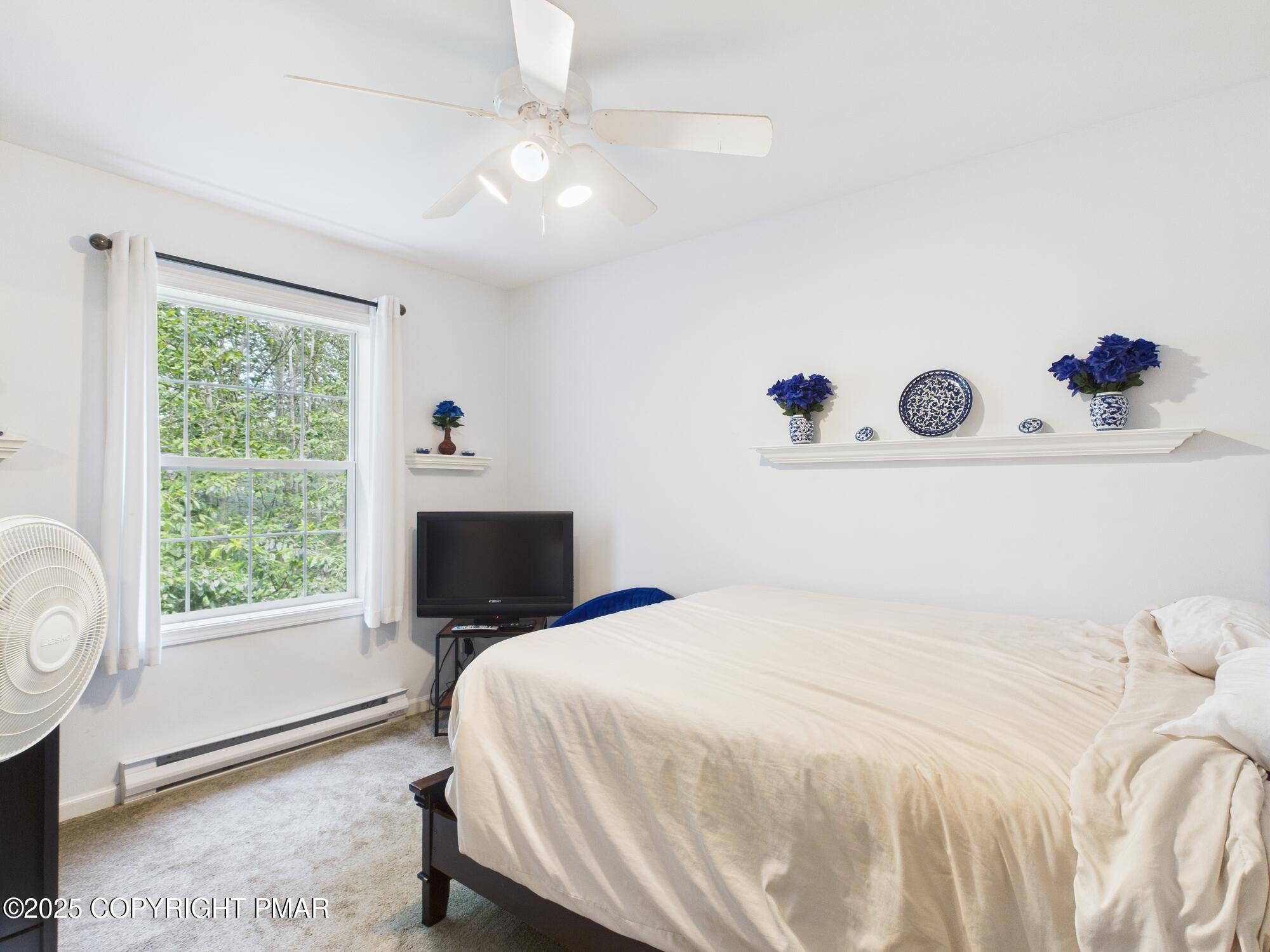 4155 Falcon Terrace Tobyhanna, PA 18466 - Photo 34 of 42 a bedroom with a bed and a window