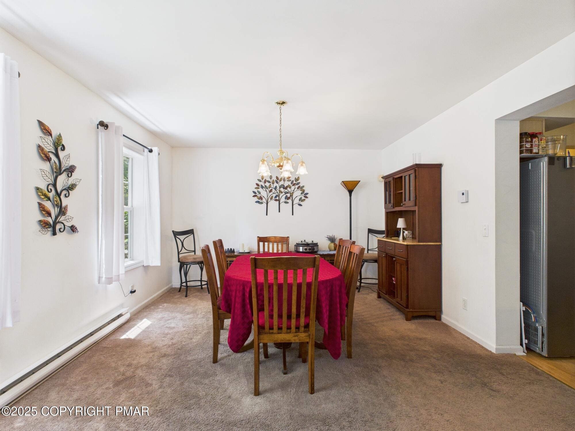4155 Falcon Terrace Tobyhanna, PA 18466 - Photo 7 of 42 a view of a dining room with furniture window and wooden floor
