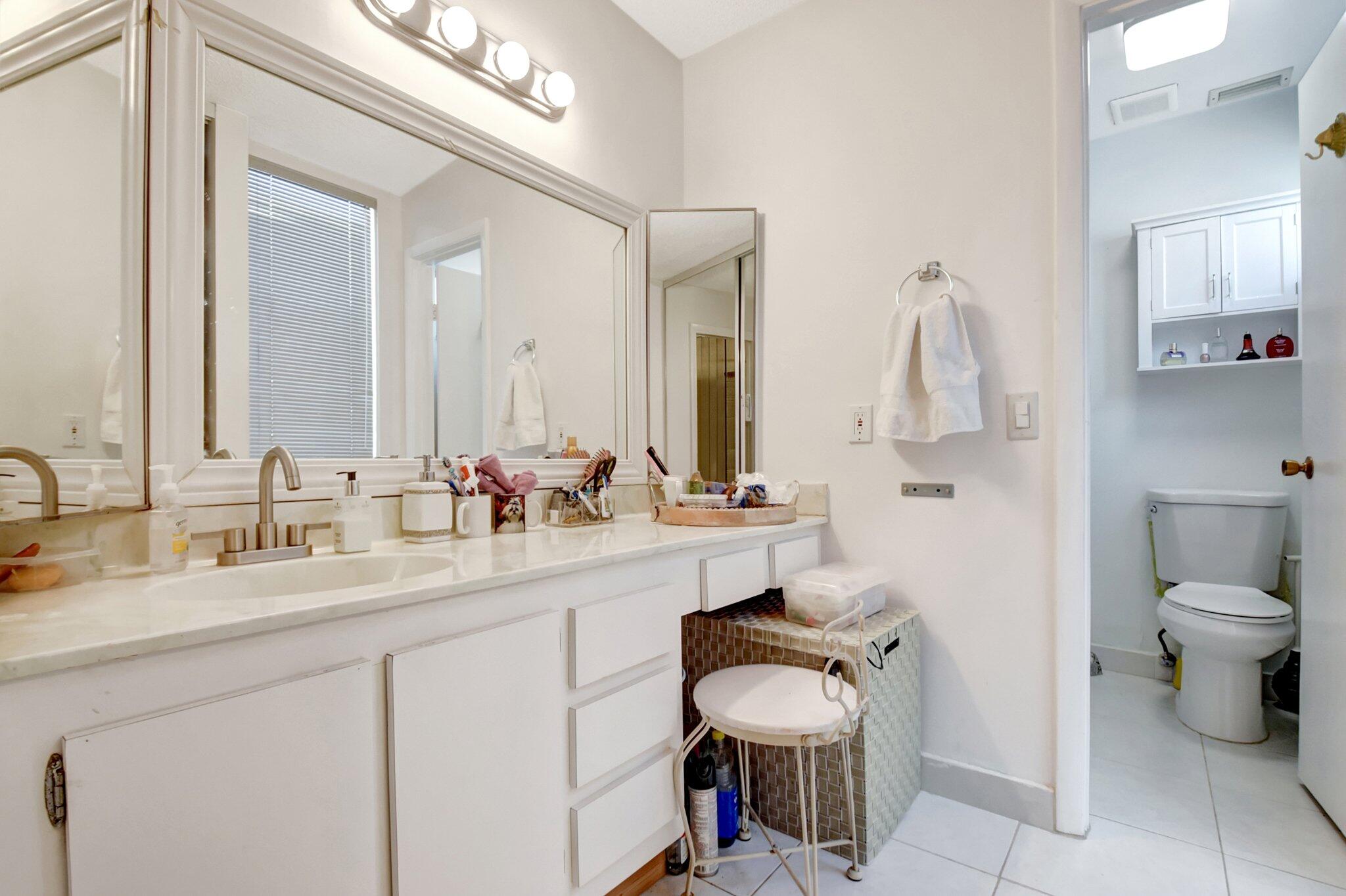 11067 Oakdale Road Boynton Beach, FL 33437 - Photo 19 of 31 a bathroom with a sink double vanity and a toilet