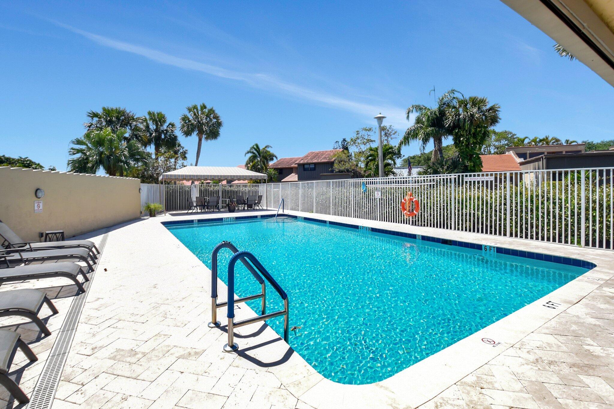 11067 Oakdale Road Boynton Beach, FL 33437 - Photo 25 of 31 a view of swimming pool with a yard and sitting area