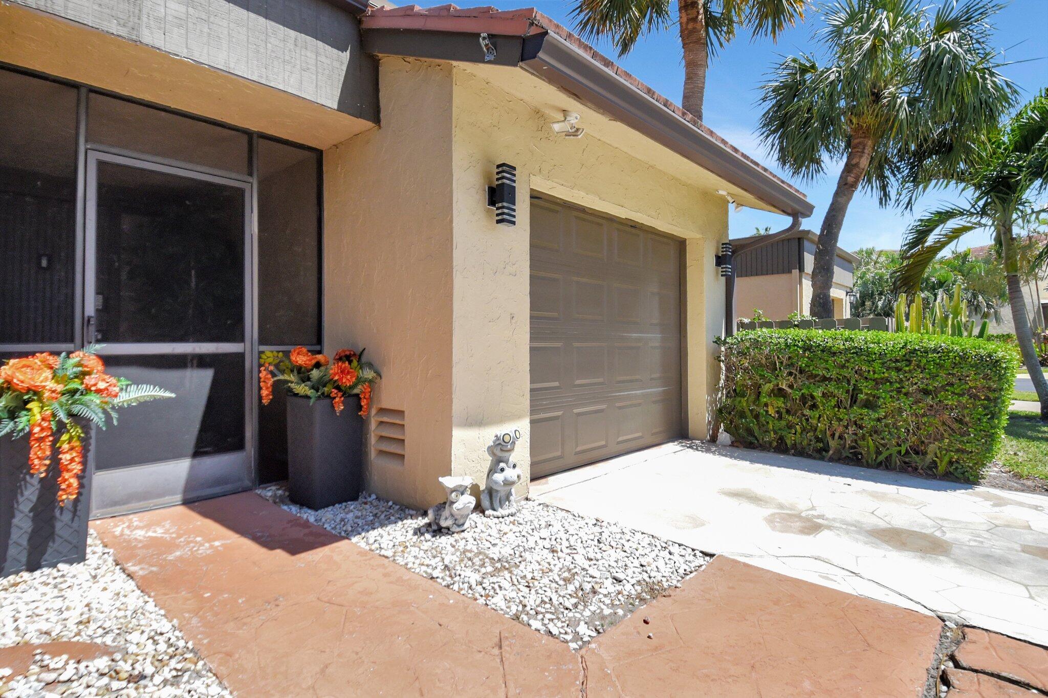 11067 Oakdale Road Boynton Beach, FL 33437 - Photo 3 of 31 a view of a entryway door front of house