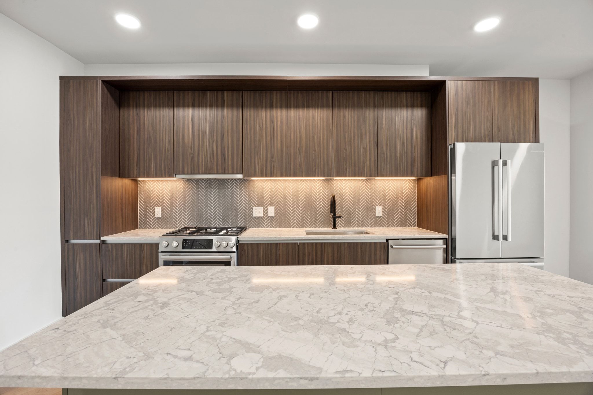 2209 South 1st Street, Unit 209 Austin, TX 78704 - Photo 1 of 33 a kitchen with refrigerator and cabinets
