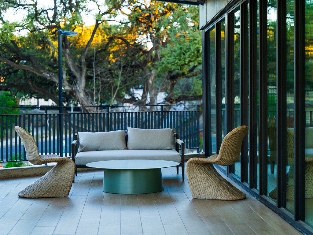 2209 South 1st Street, Unit 209 Austin, TX 78704 - Photo 14 of 33 a view of a patio with couches chairs and wooden fence
