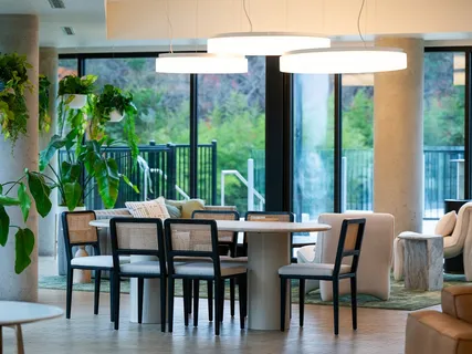 a view of a dining room with furniture window and outside view