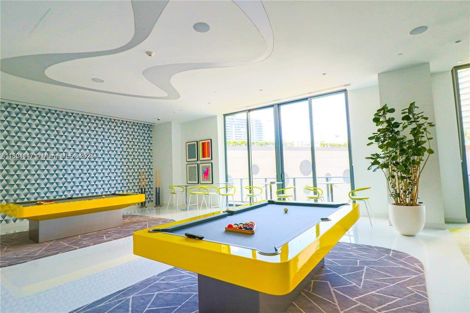 501 Northeast 31st Street, Unit 2005 Miami, FL 33137 - Photo 25 of 30 a room with pool table and windows