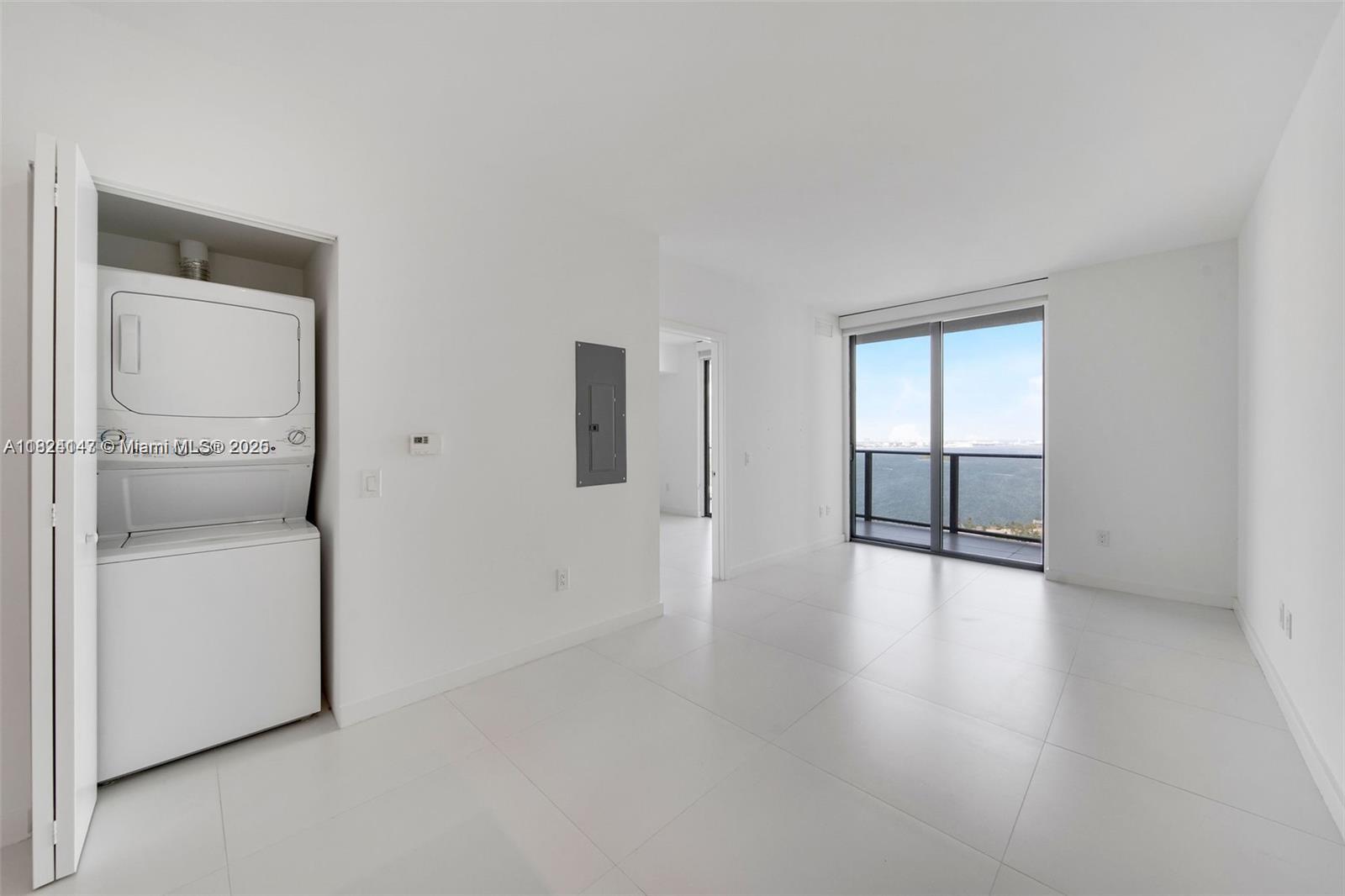 501 Northeast 31st Street, Unit 2005 Miami, FL 33137 - Photo 9 of 30 a view of an empty room with a window and wooden floor