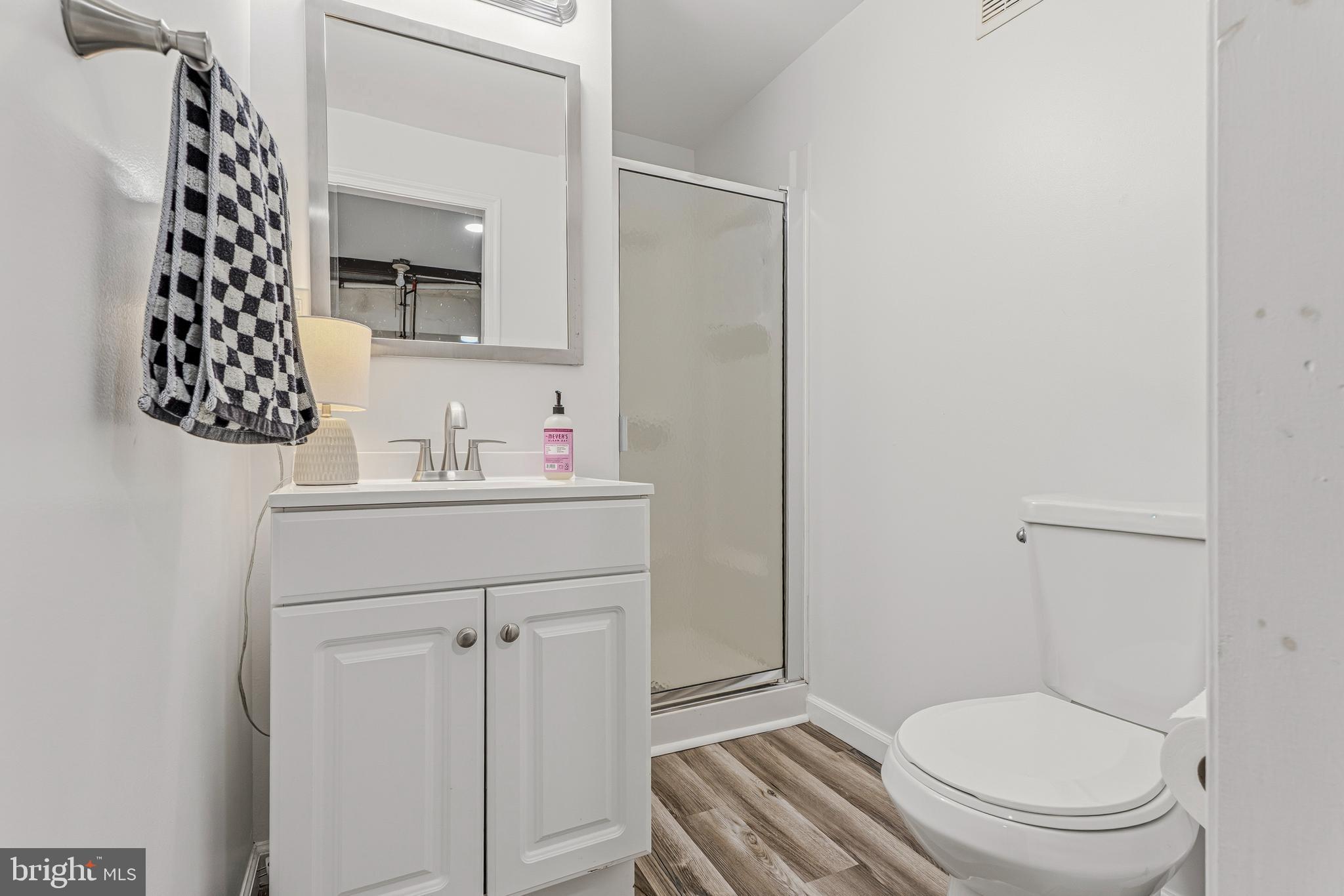 314 Murdock Road Baltimore, MD 21212 - Photo 31 of 42 a bathroom with a toilet sink and mirror