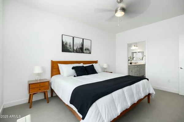 a bedroom with bed and window
