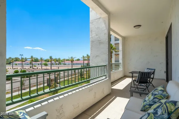 a view of balcony with furniture