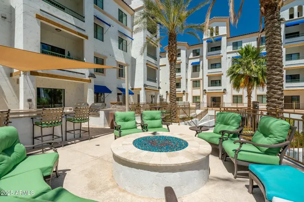 a view of a chairs and table in a patio