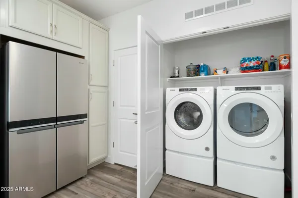 a utility room with dryer and washer