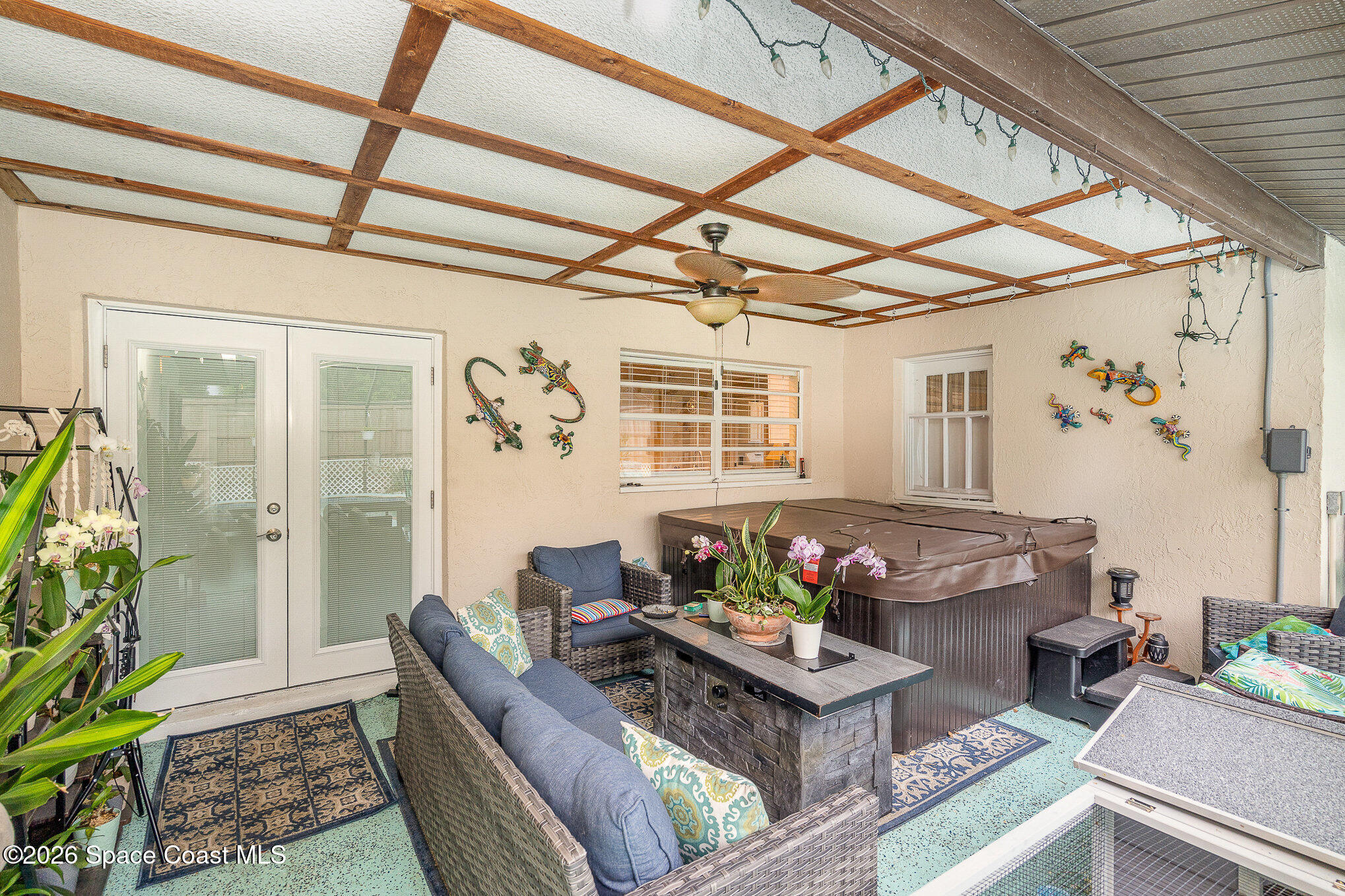1069 Fairlawn Drive Rockledge, FL 32955 - Photo 28 of 30 a living room with furniture and a potted plant