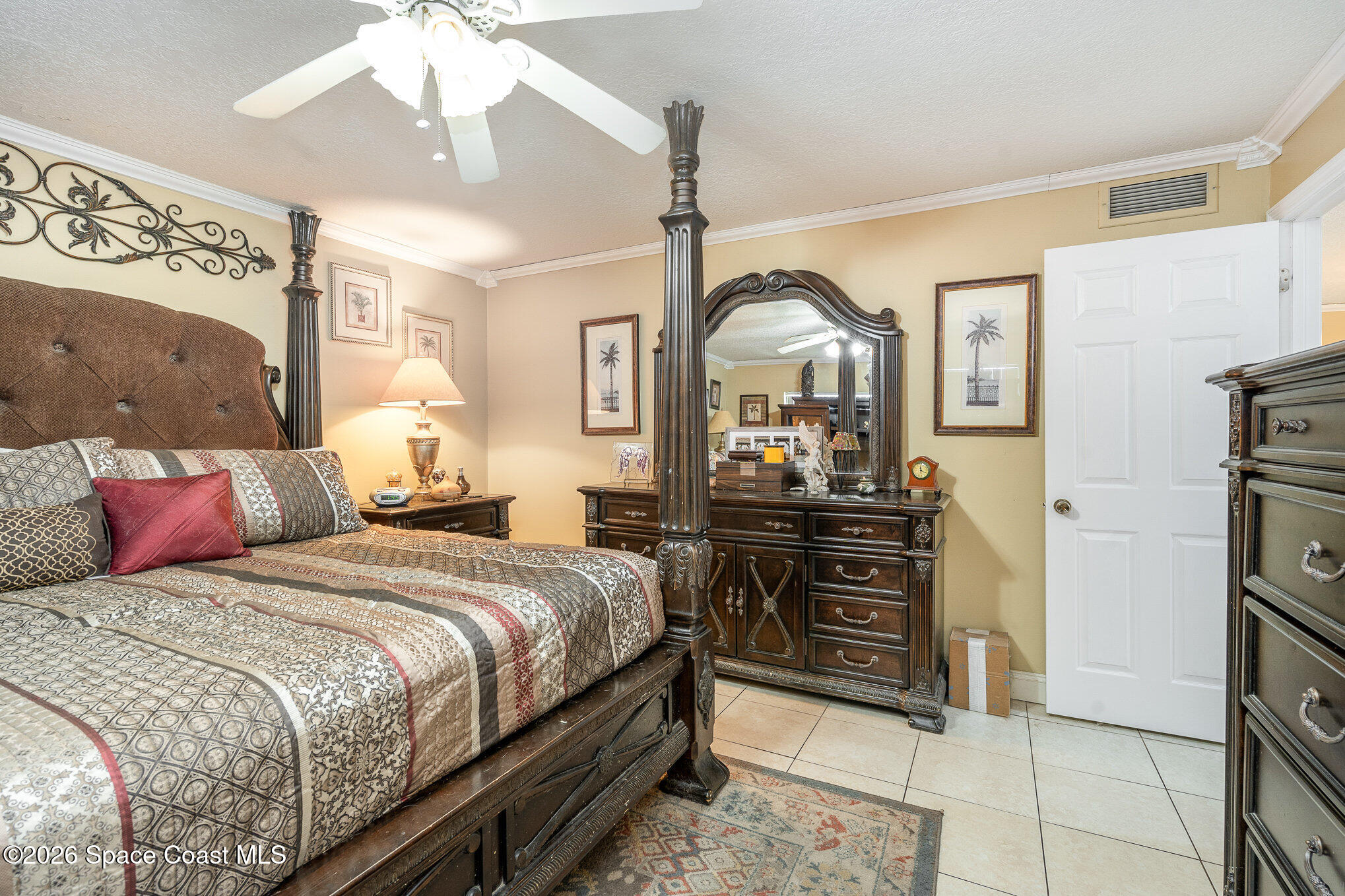 1069 Fairlawn Drive Rockledge, FL 32955 - Photo 3 of 30 a bedroom with a bed and a mirror on the dresser