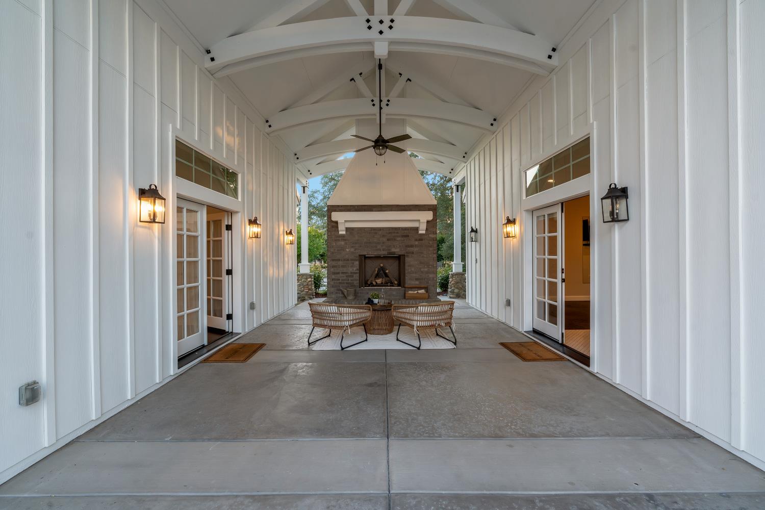2905 Virginiatown Road Lincoln, CA 95648 - Photo 44 of 86 Covered outdoor patio featuring a stone-clad fireplace and exposed ceiling trusses