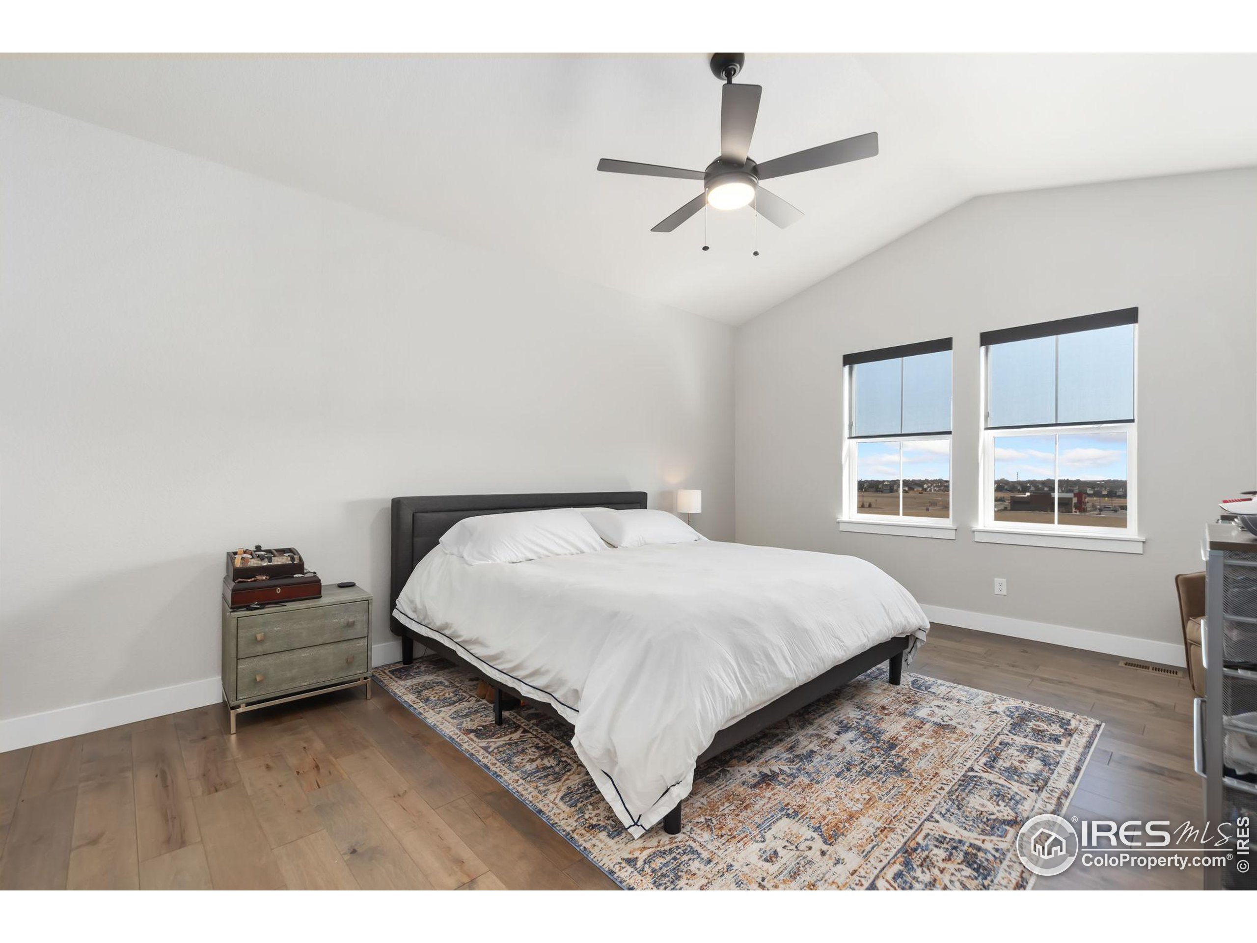 2748 Prairie Flax Street Berthoud, CO 80513 - Photo 15 of 40 a bedroom with a bed and a window