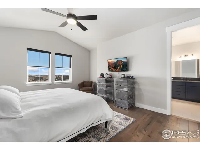 a bedroom with a bed dresser and a window